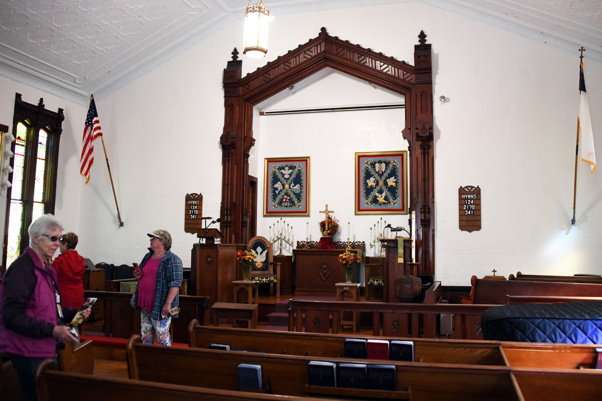 215 Monica Broughton, Mary Scott and Rynee Spencer examine the 140 year old Methodist Church.jpg